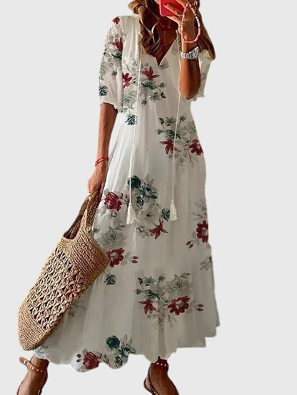Boho summer dress in white with red and green floral print, short sleeves, tiered skirt