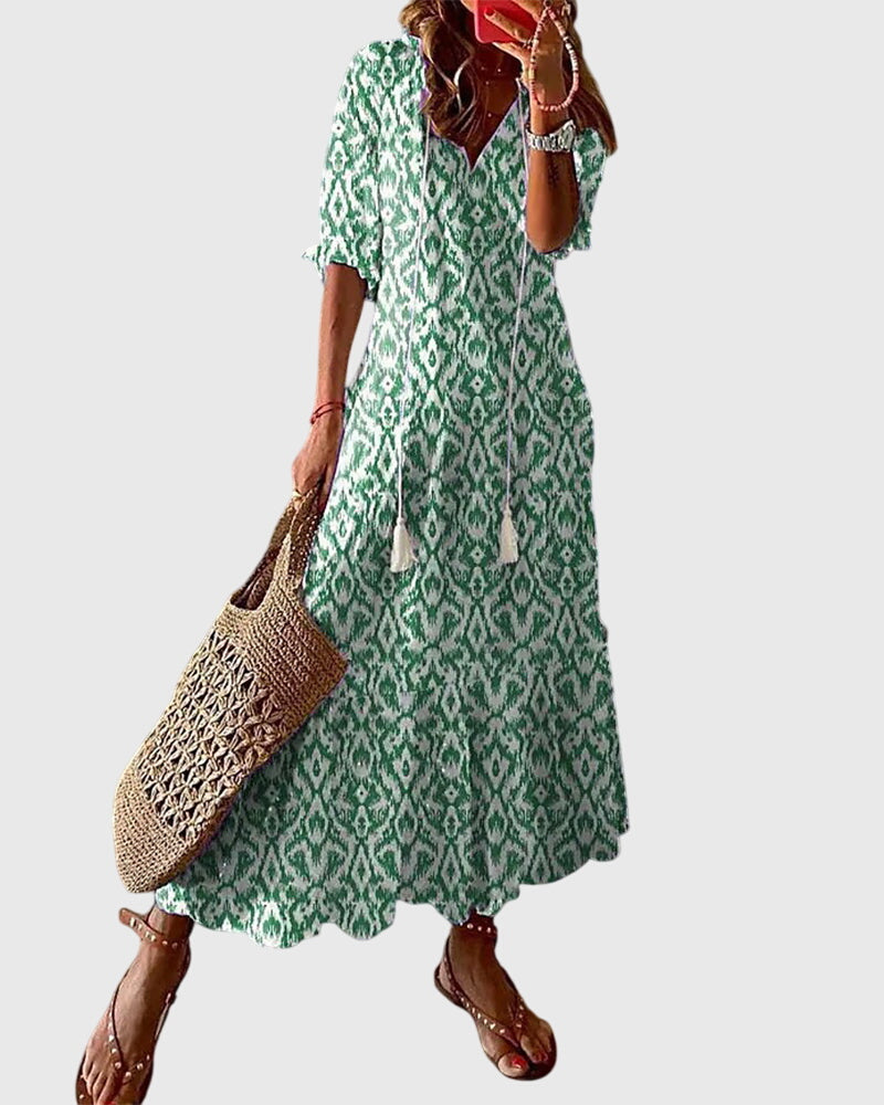 Boho summer dress in green with diamond ikat pattern, short sleeves, tiered skirt