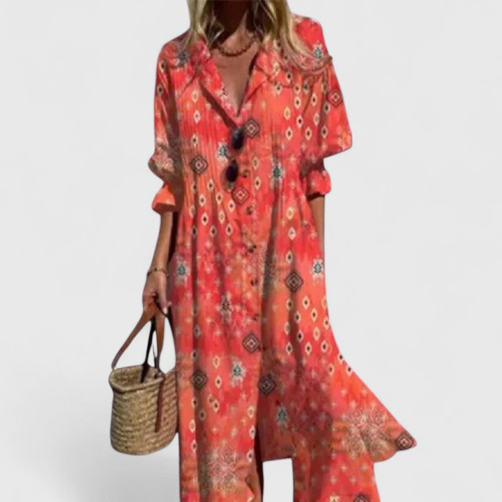 Coral red patterned boho dress with V-neck and button front, elbow-length sleeves.