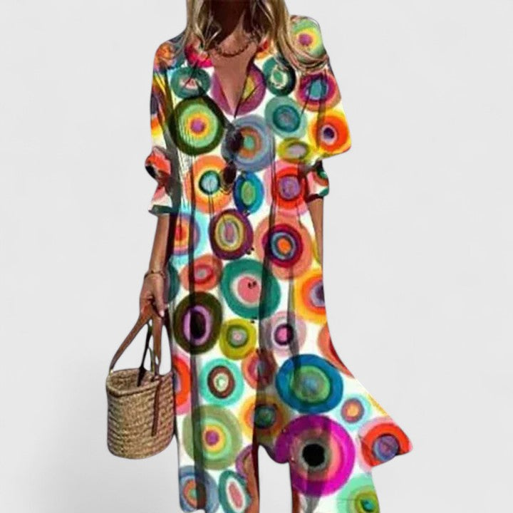 Multicolor circle print boho dress with V-neck and button front, flowing skirt.