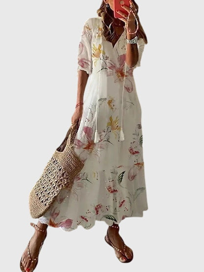 Boho summer dress in white with multicolor floral print, short sleeves, tiered skirt