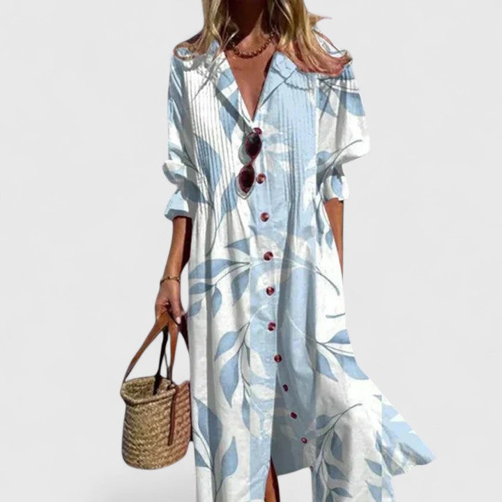 Light blue and white leaf print boho dress with V-neck and button front, ruffled hem.
