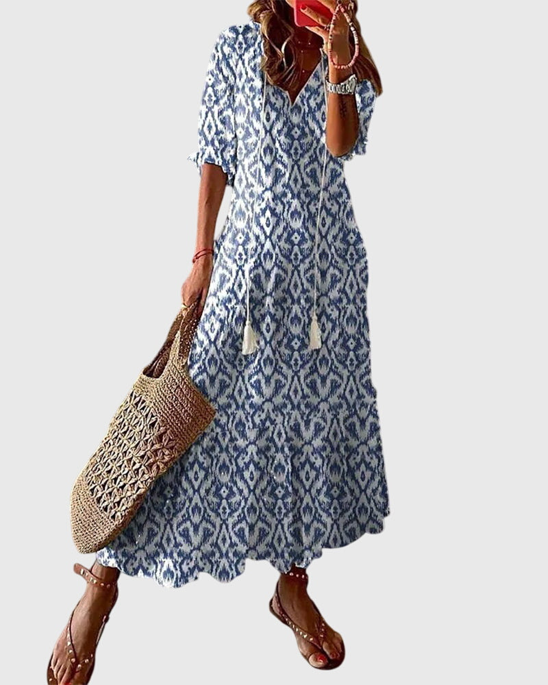 Boho summer dress in blue with diamond ikat pattern, short sleeves, tiered skirt