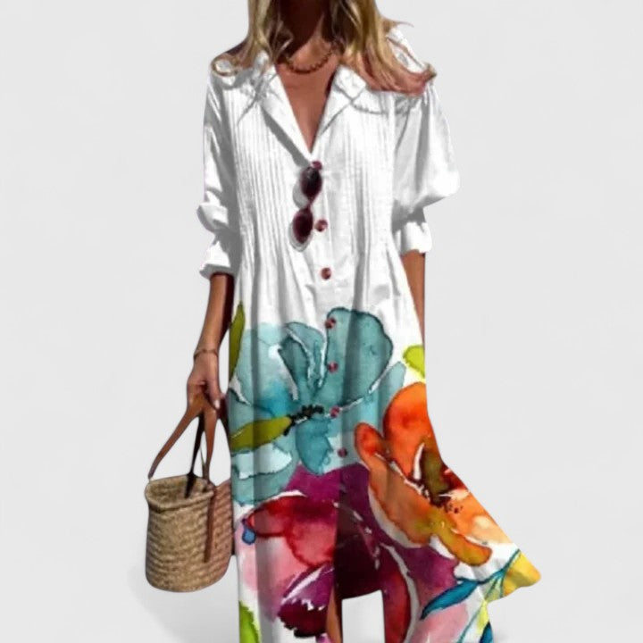 White boho dress with colorful floral print panel and V-neck button front, midi length.