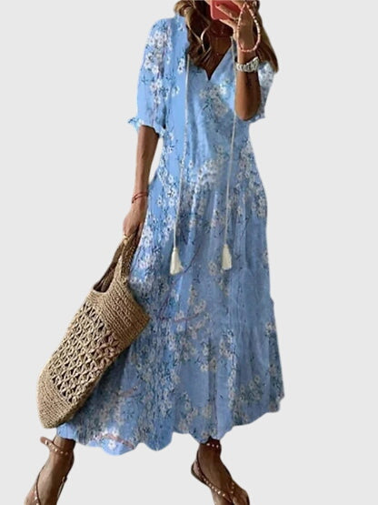 Boho summer dress in light blue with subtle pattern, short sleeves, tiered skirt