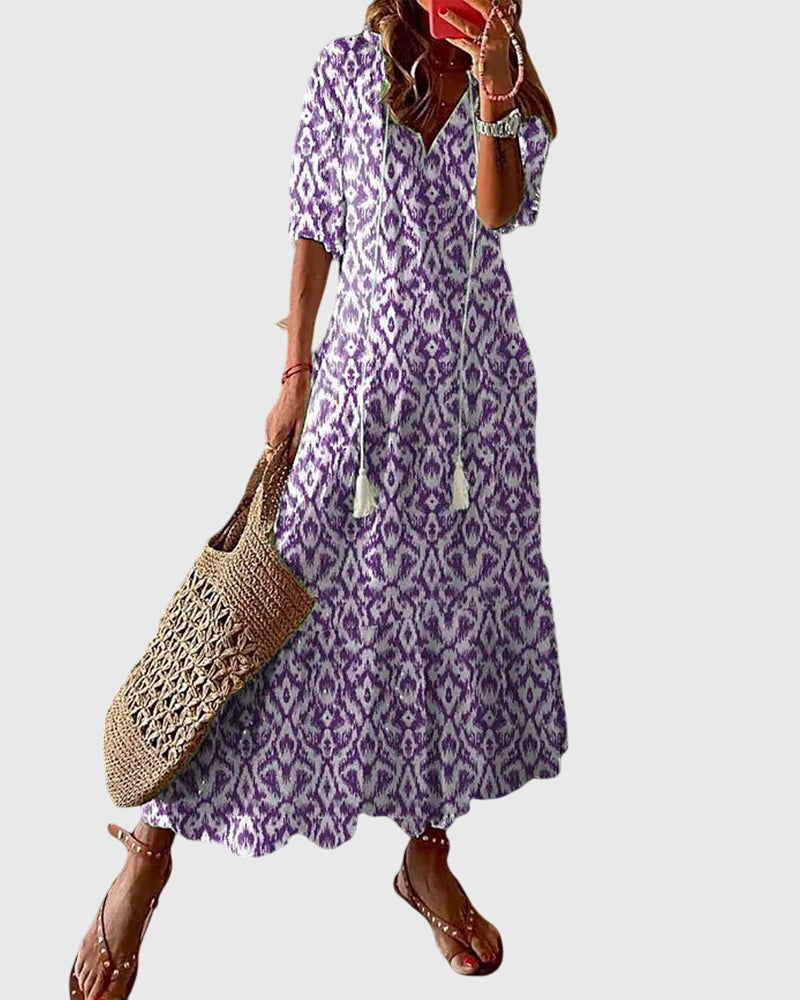 Boho summer dress in purple with diamond ikat pattern, short sleeves, tiered skirt