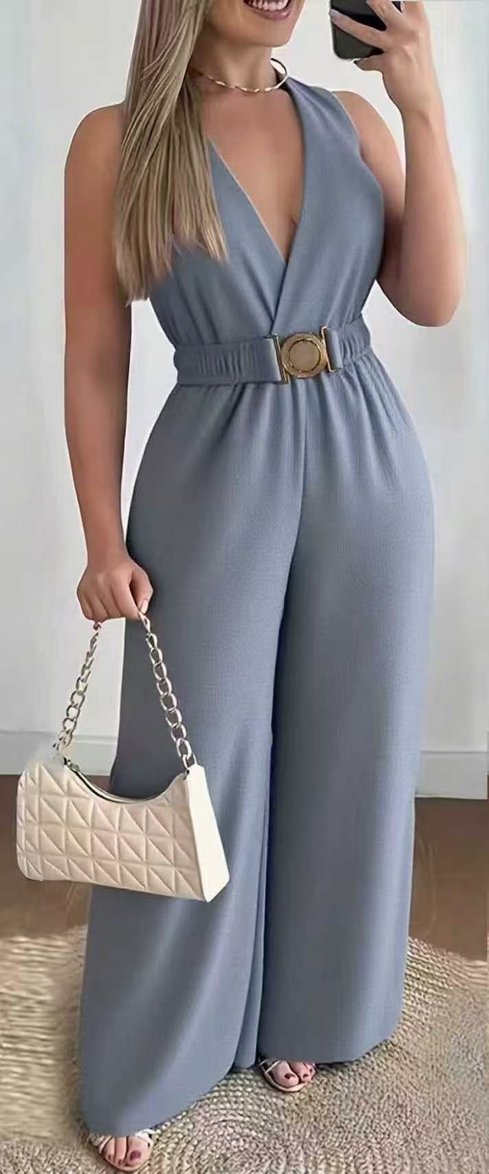 Elegante Mouwloze Jumpsuit met Diepe V-Hals en Wijde Pijpen